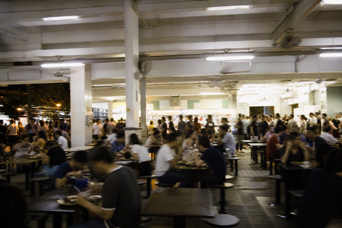 A busy hawker centre at a peak mealtime